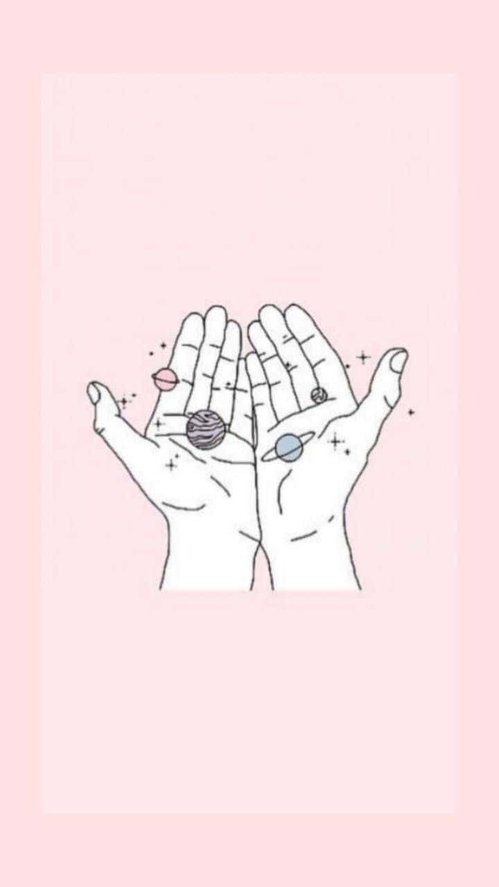 hand 桌布 壁紙 — 兩隻手捧著張開，在柔和的粉紅色背景上，以精緻的線條繪畫風格托著微型行星和星星。