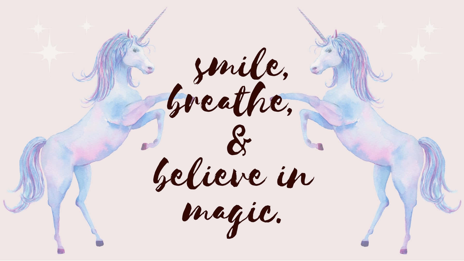 Magical Unicorn 桌布 壁紙 — 兩隻粉彩水彩獨角獸面對面，中間有一句勵志名言在星空背景下發光。