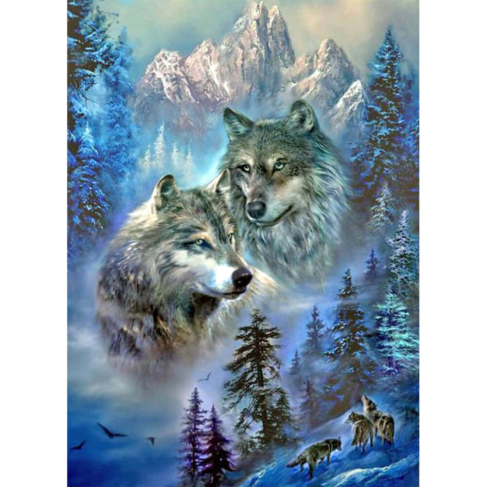 Beautiful Wolf 桌布 壁紙 — 兩隻雄偉的狼在白雪覆蓋的森林中向前凝視，背景有高聳的山脈和迷濛的藍色調。