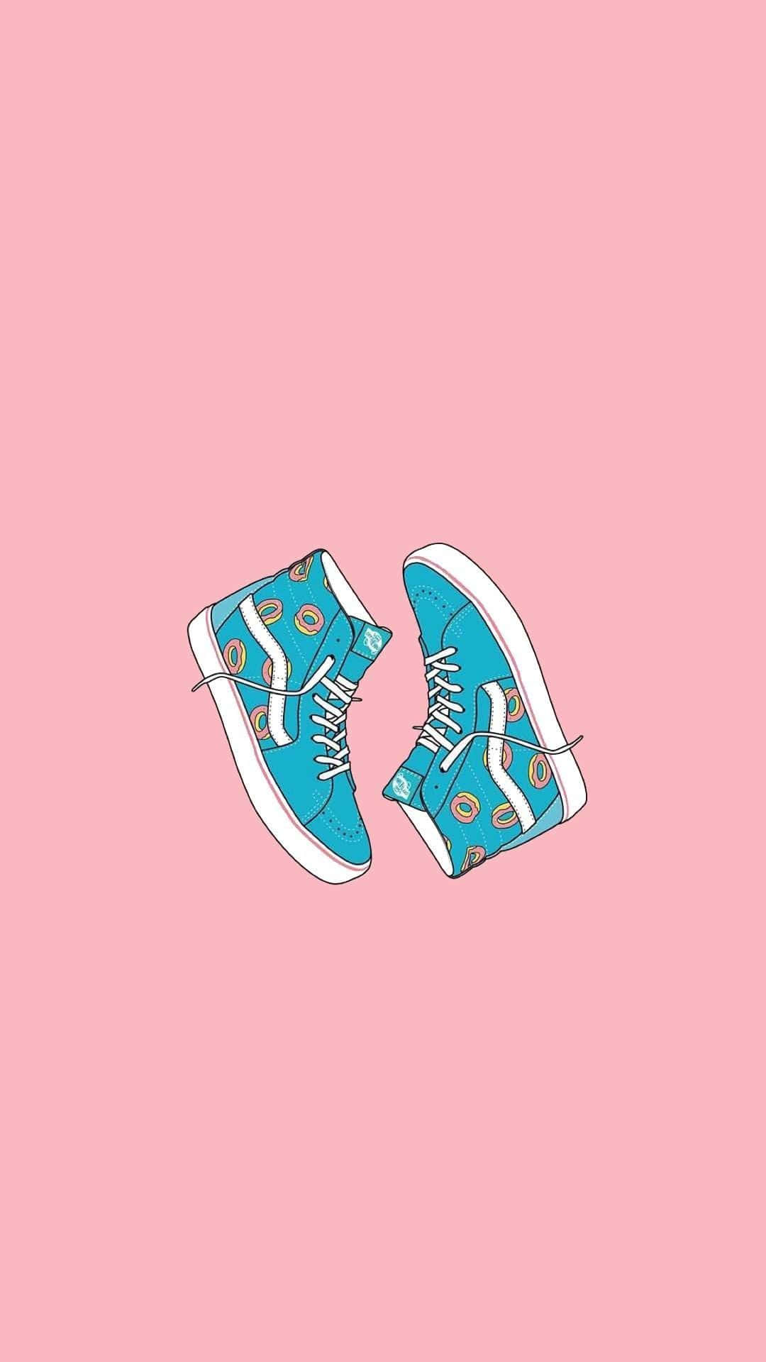 Cute Shoes 桌布 壁紙 — 兩雙帶有甜甜圈圖案的藍綠色高筒運動鞋漂浮在柔和的粉紅色背景上。