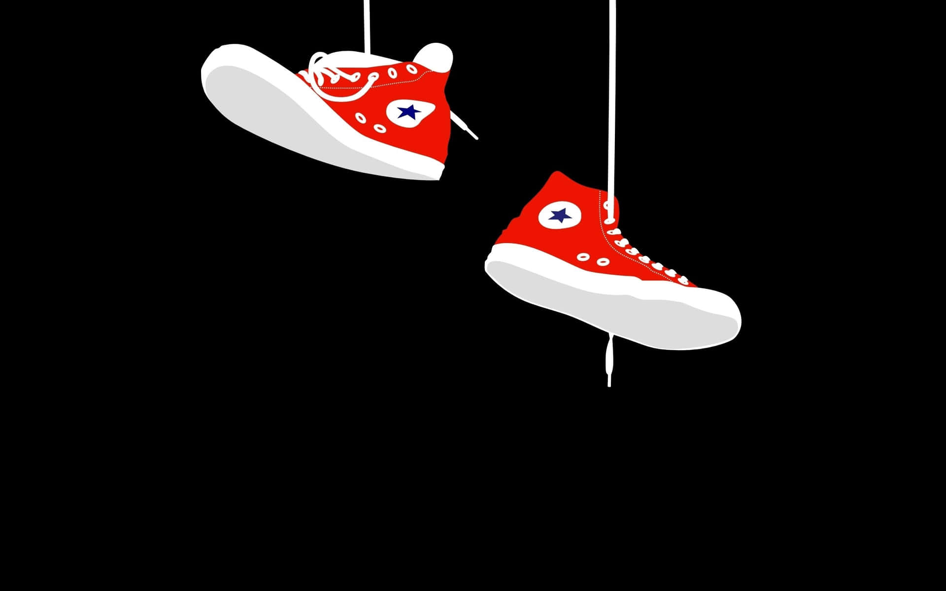 Converse 桌布 壁紙 — 兩雙紅色高筒運動鞋，白色鞋底和星星標誌，用繩子懸掛在純黑色背景上。