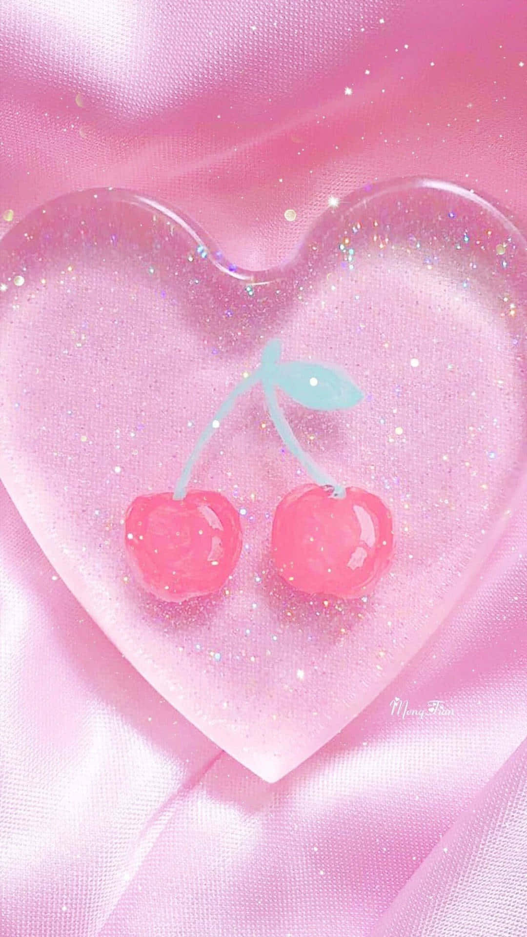 Aesthetic Cute Profile 桌布 壁紙 — 兩顆帶有淺藍色莖的光澤粉紅櫻桃，位於一個閃閃發光的心形樹脂吊墜內，背景是柔軟的粉紅緞面。