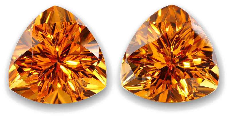 Gemstone 桌布 壁紙 — 兩顆帶有複雜切割面的耀眼橙色寶石，在純白背景上閃爍光芒。