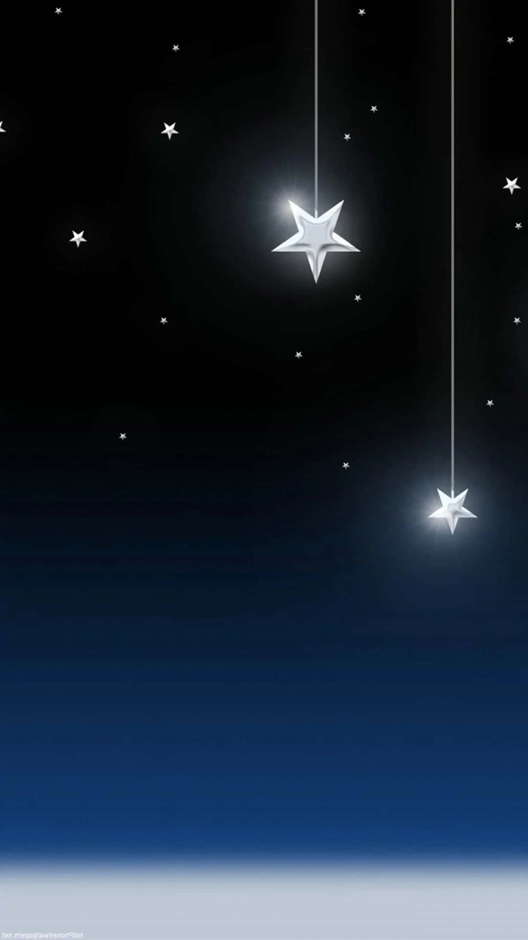 3d Star 桌布 壁紙 — 兩顆發光的銀色星星用細線懸掛在黑暗的夜空中，底部逐漸褪成深藍色。