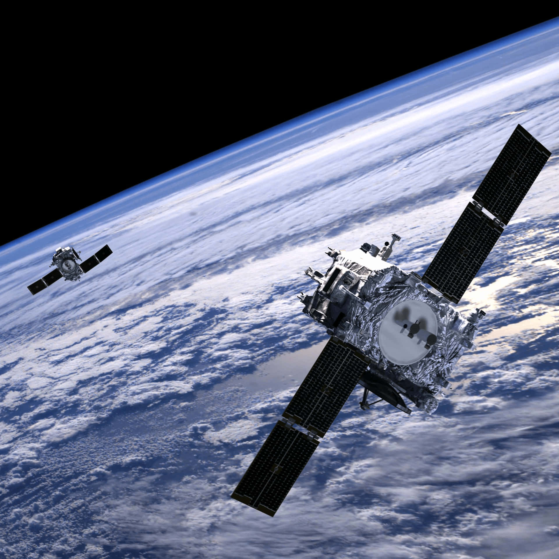 Satellite 桌布 壁紙 — 兩顆詳細的衛星繞地球運行，下方是藍色雲層覆蓋的行星，背景為黑色太空。