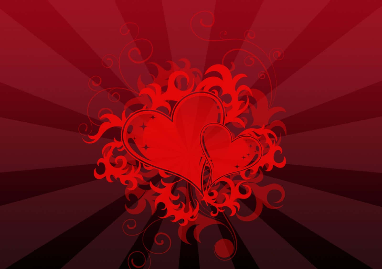 Red Heart 桌布 壁紙 — 兩顆風格化的紅色心形，纏繞著旋轉的花卉圖案，襯以放射狀的紅色漸變背景。