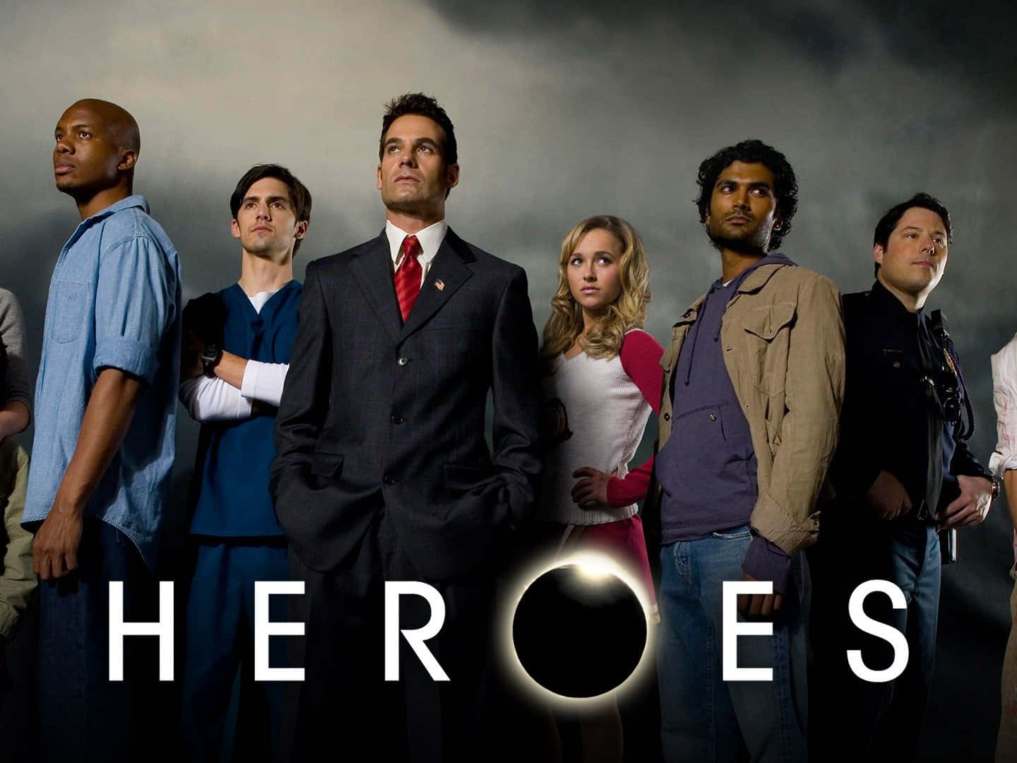 heroes 桌布 壁紙 — 六個不同的角色莊嚴地站在暴風雨的灰色天空下，下方閃耀著HEROES這個詞。