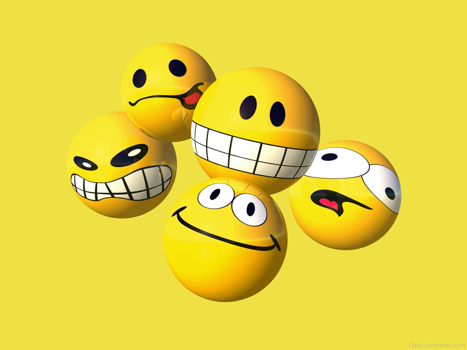 Smile 桌布 壁紙 — 六個光滑的黃色表情符號球體，帶有各種俏皮的表情，漂浮在純黃色背景上。