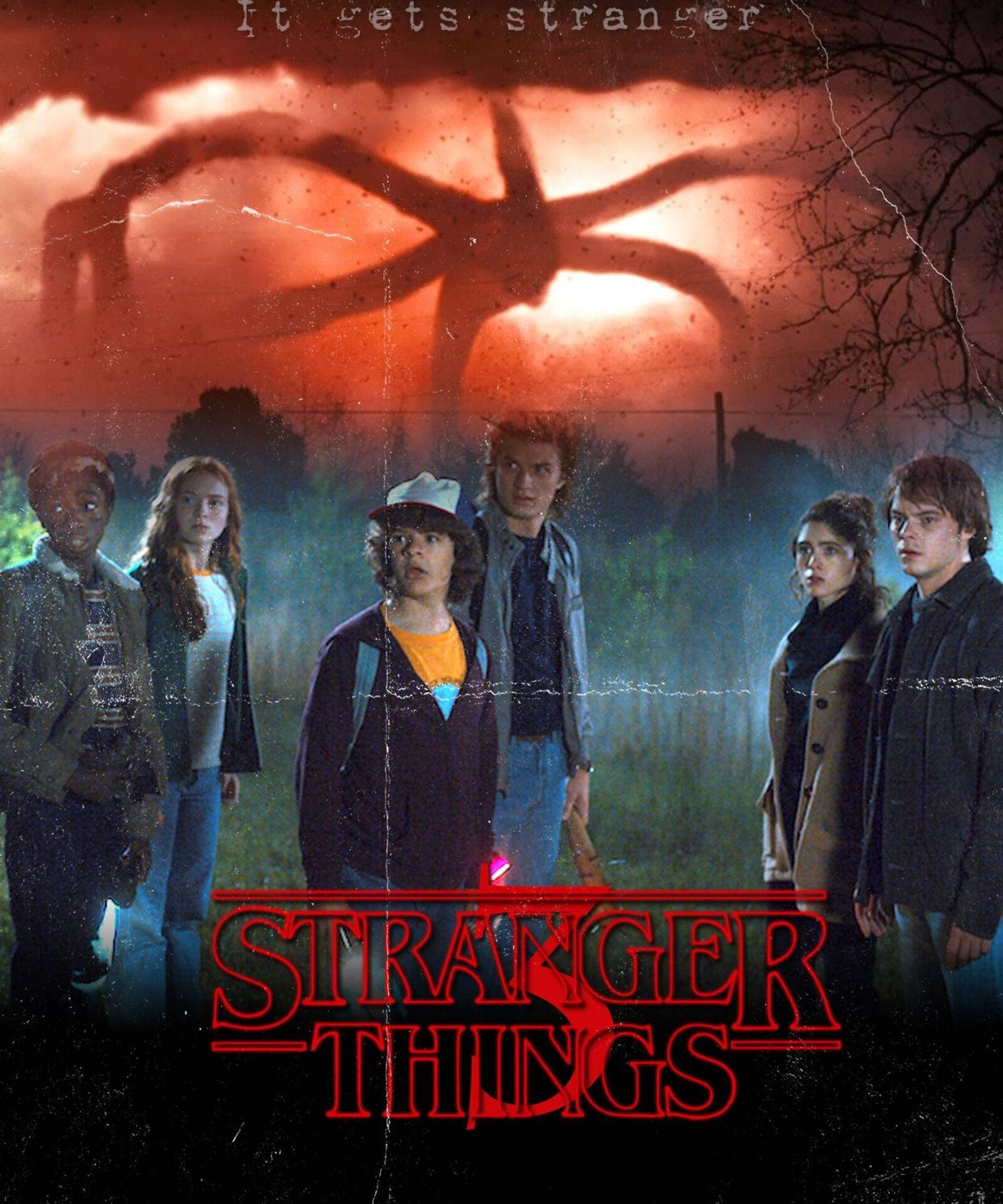 Stranger Things 3 桌布 壁紙 — 六個青少年站在霧氣瀰漫的田野中，一個巨大的陰影籠罩著他們，紅色的天空在他們上方逼近。