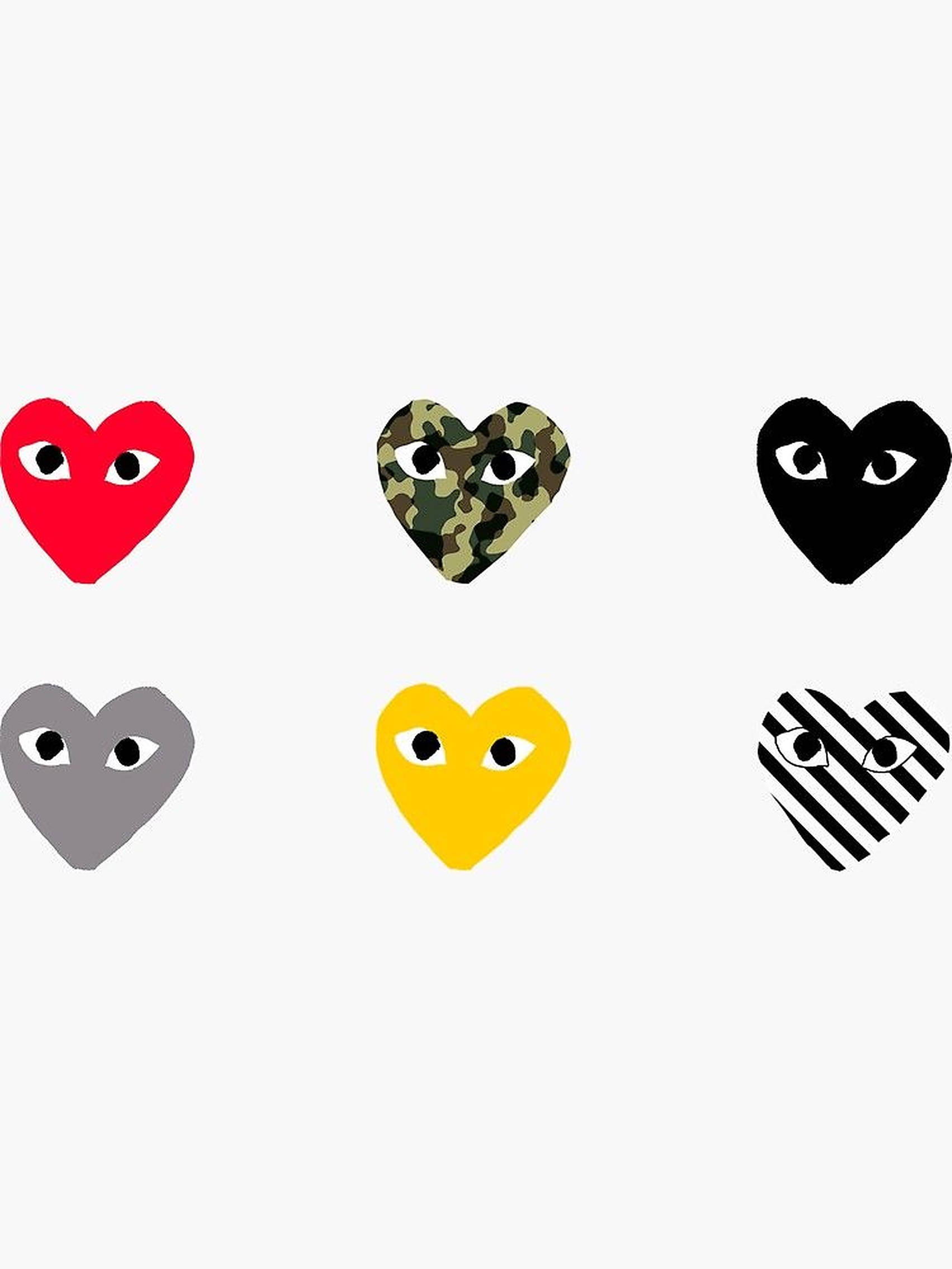 cdg 桌布 壁紙 — 六個風格化的心形，分別為紅色、灰色迷彩、黑色、黃色和條紋，每個有兩隻眼睛，在純白色背景上。