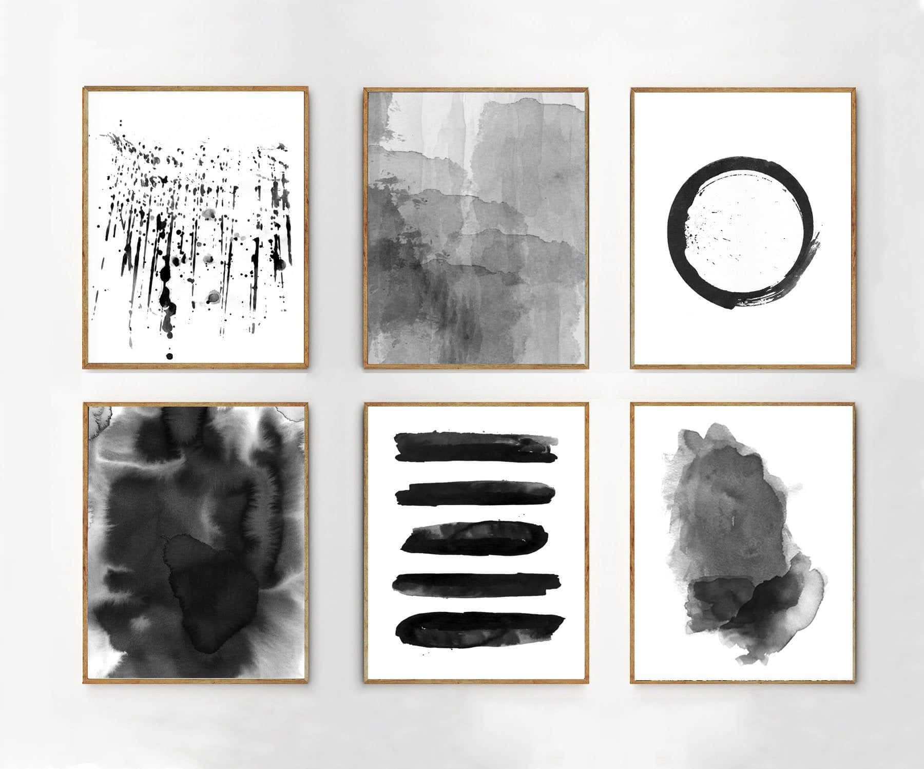 Modern Minimalist Art 桌布 壁紙 — 六幅極簡黑白抽象水彩藝術作品，裝在淺色木框內，整齊地掛在純白牆上。