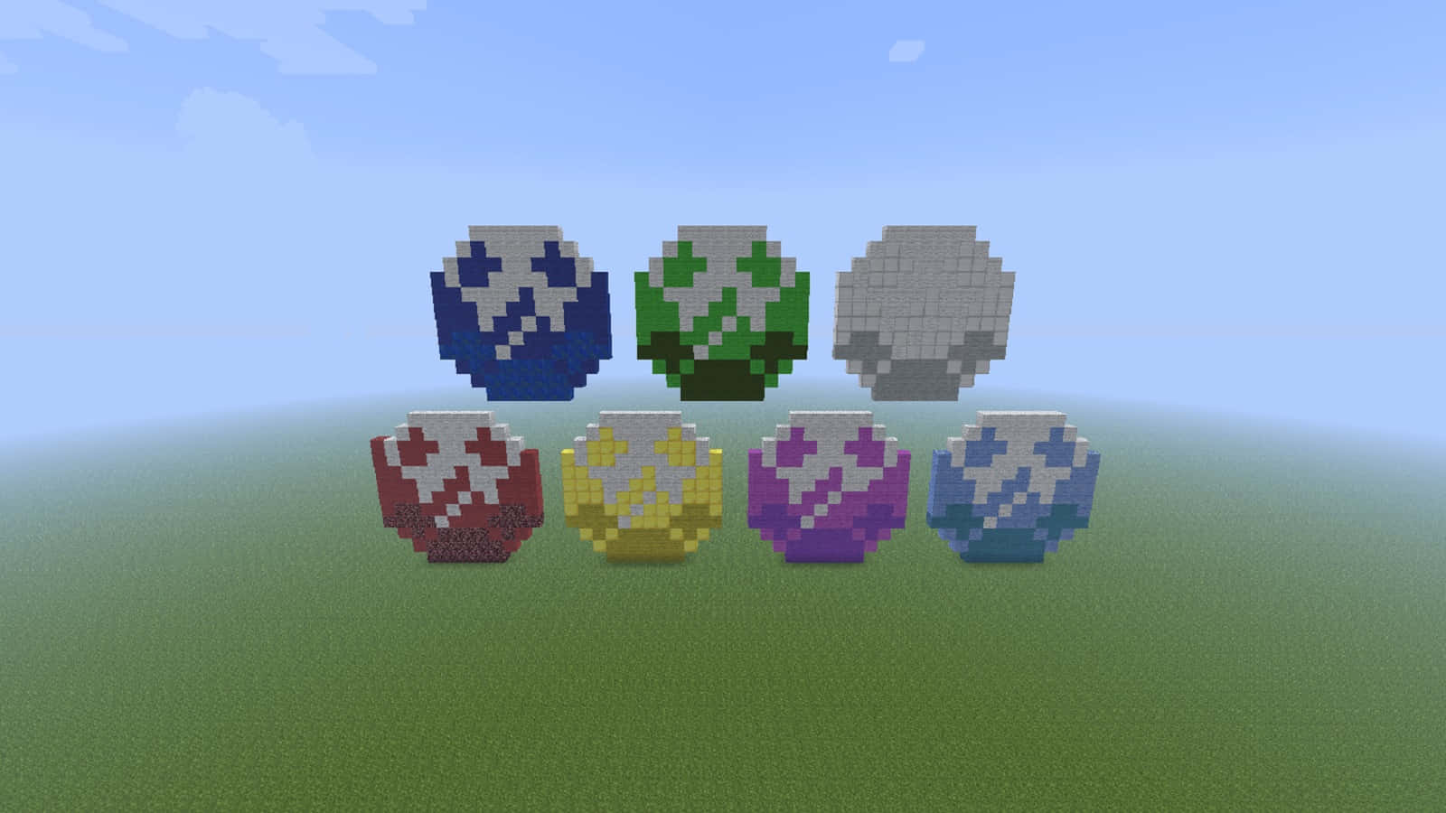 Chaos Emeralds 桌布 壁紙 — 六本像素化Minecraft風格的附魔書，帶有彩色發光符號，坐落在青草山坡上，天空晴朗蔚藍。