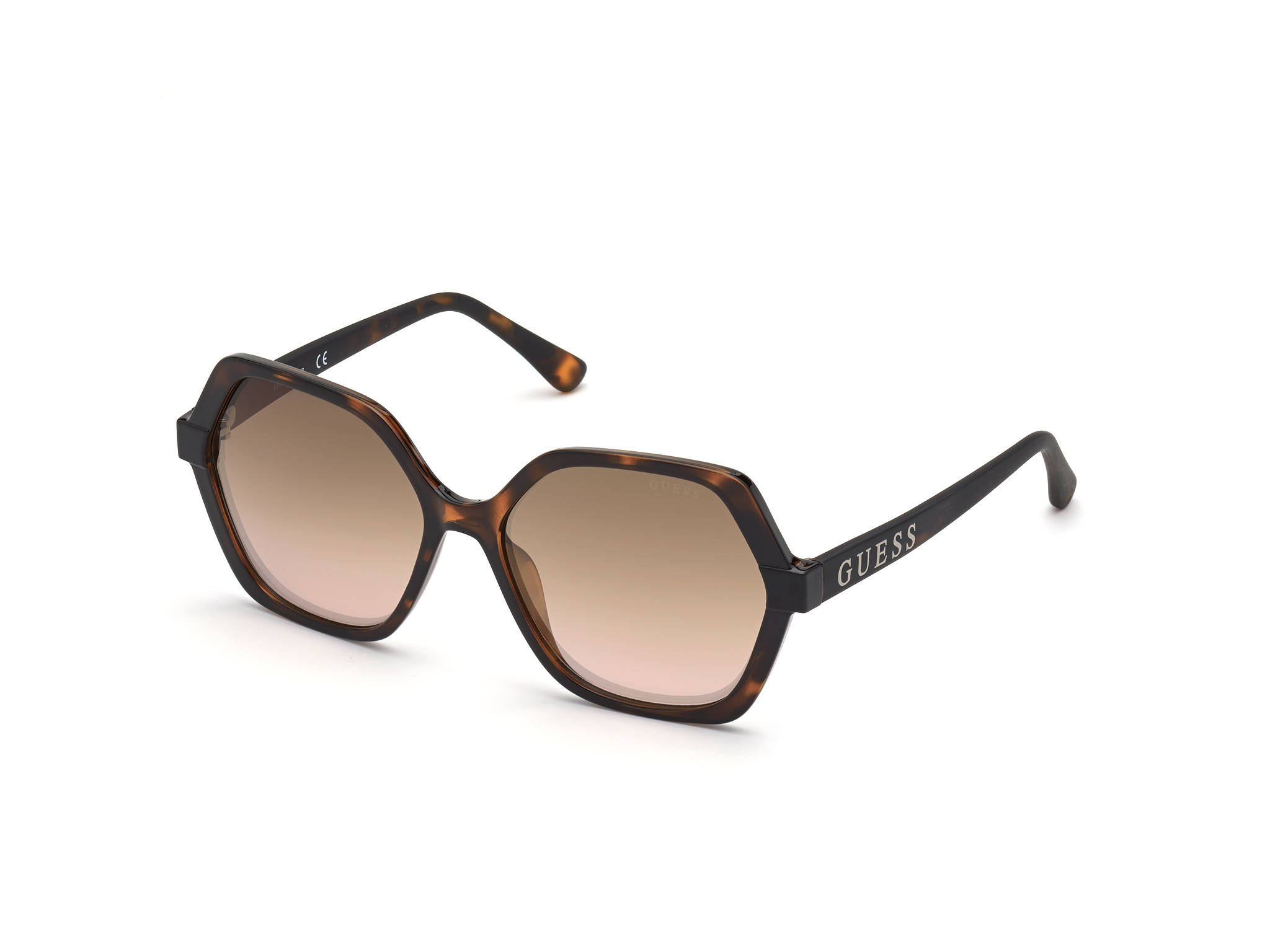 Sunglasses 桌布 壁紙 — 六角形玳瑁太陽眼鏡，搭配漸層棕色鏡片，鏡腳上有「GUESS」品牌標誌，純白背景。