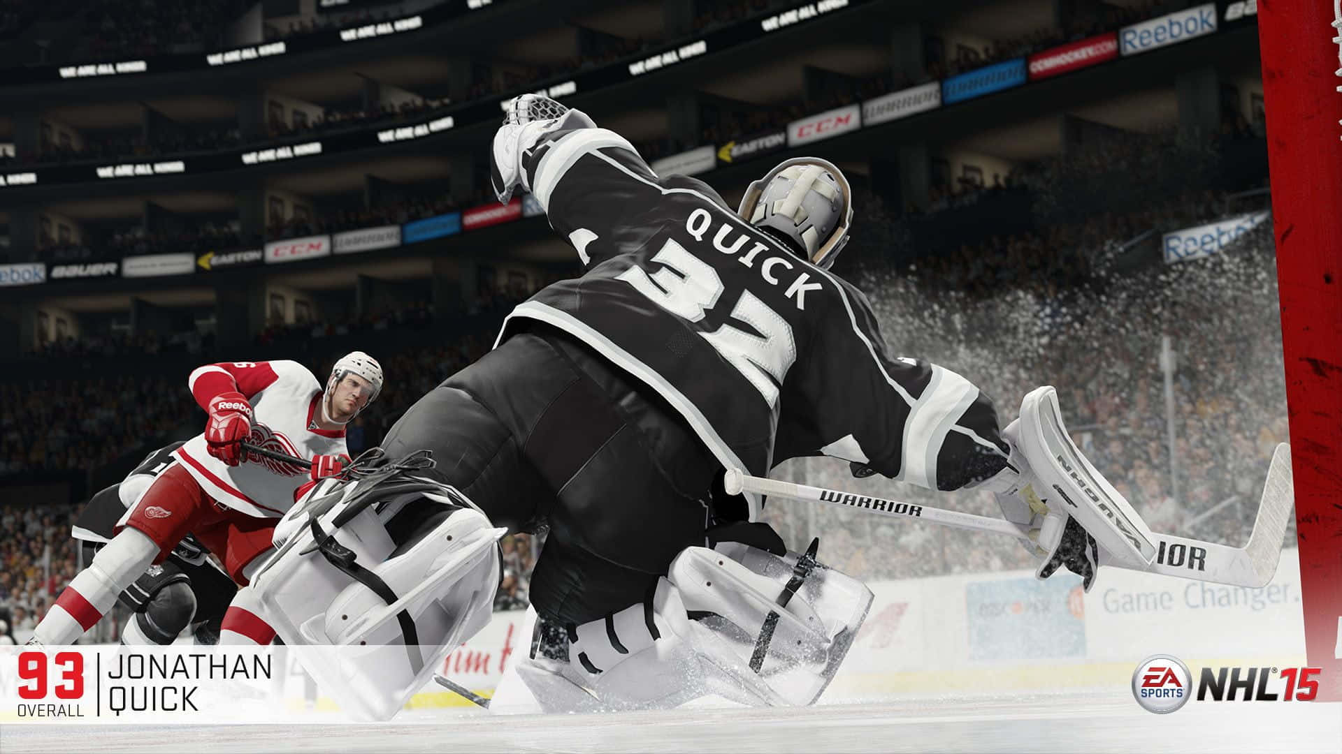 Jonathan Quick 桌布 壁紙 — 冰球守門員Jonathan Quick在激烈的NHL比賽中飛身撲救，背景有觀眾和場館燈光。