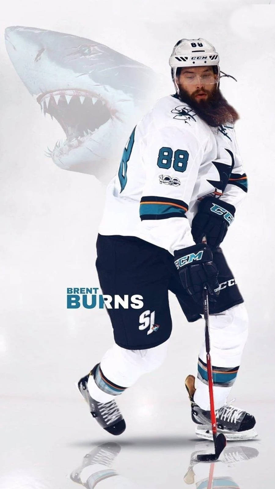 運動 桌布 壁紙 — 冰球運動員 Brent Burns 身穿鯊魚隊裝備，在反射冰面上大步向前，身後浮現一個巨大的鯊魚頭。