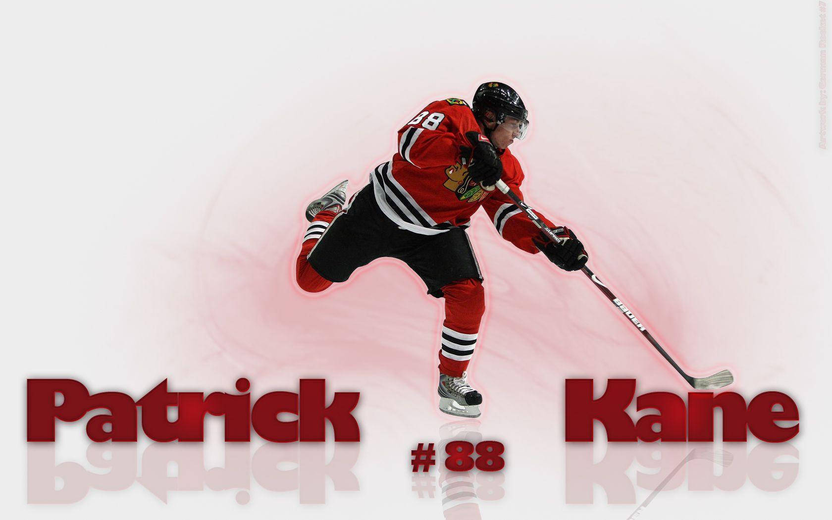 運動 桌布 壁紙 — 冰球運動員 Patrick Kane 身穿紅色黑鷹隊球衣，在柔和的粉紅色漸變背景上動態滑行。