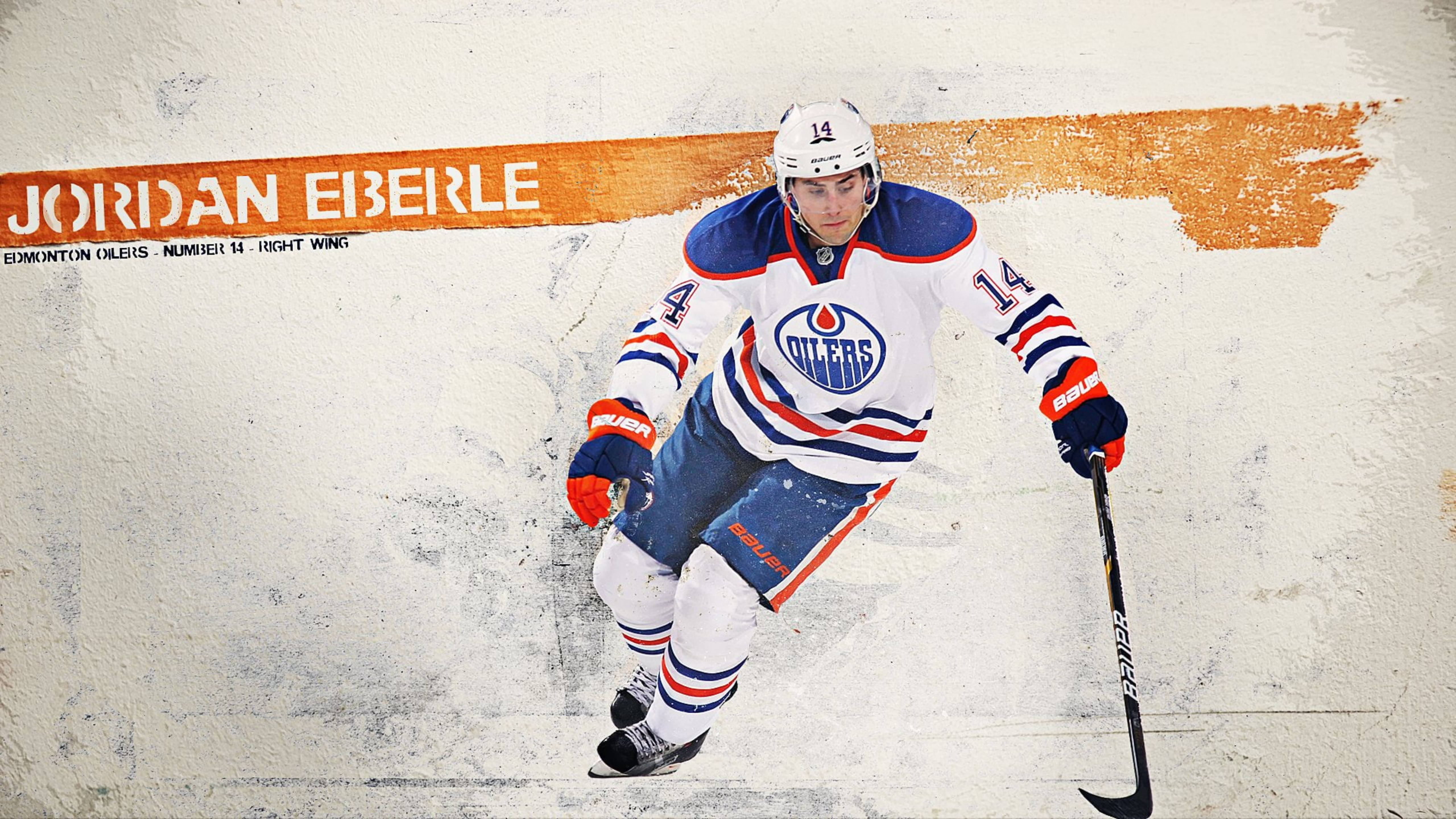 Oilers 桌布 壁紙 — 冰球運動員Jordan Eberle身穿埃德蒙頓油人隊制服，在紋理牆壁背景前動態溜冰。