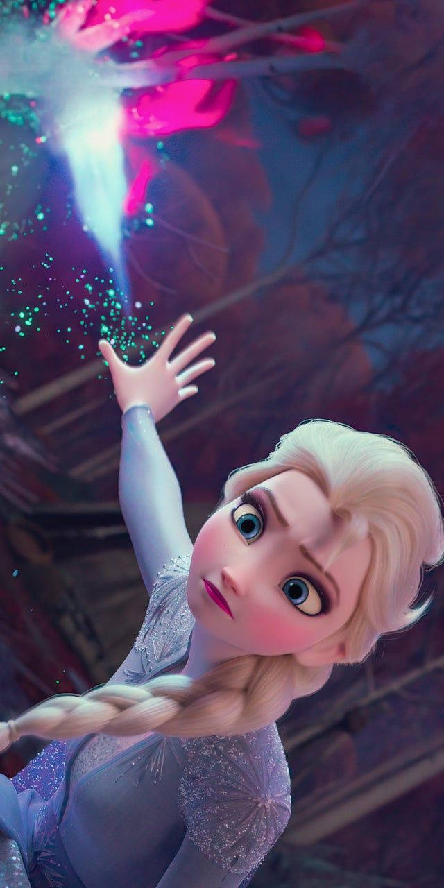 艾莎 桌布 壁紙 — 《冰雪奇緣》的艾莎伸出手，魔法冰晶在她周圍旋轉，構成充滿活力的冬日場景。