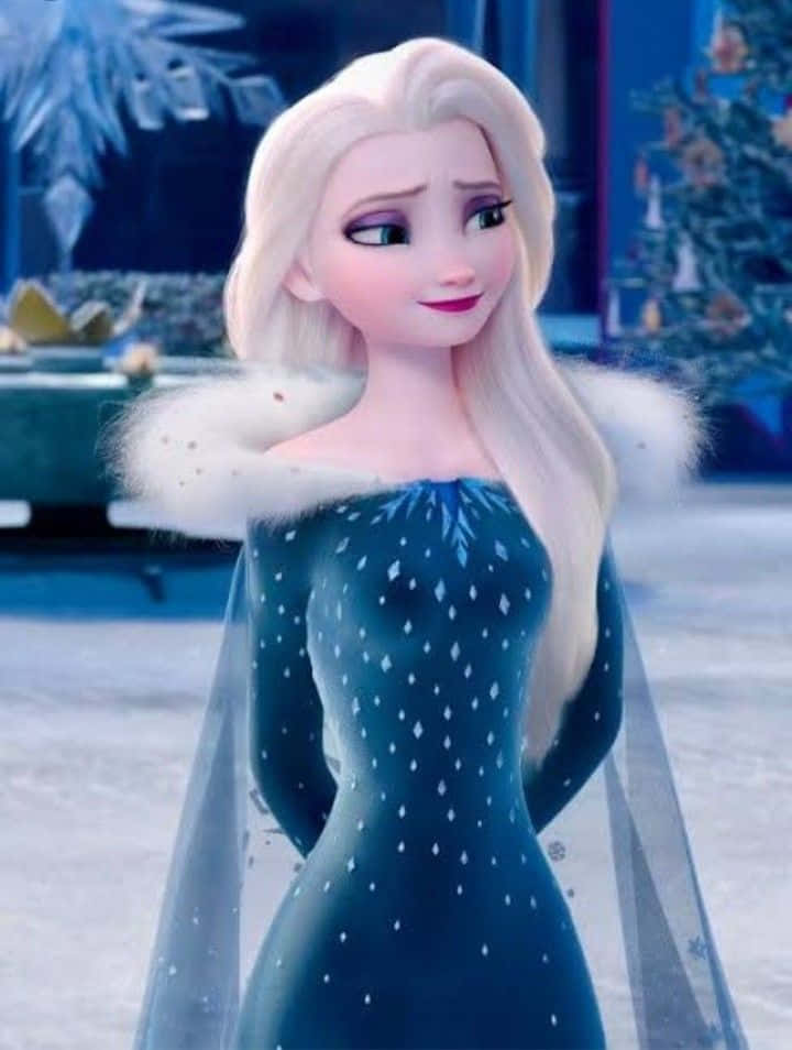 冰雪奇緣 桌布 壁紙 — 冰雪奇緣的艾莎站在雪白的宮殿中，穿著她標誌性的藍色冰裙，搭配白色毛領。