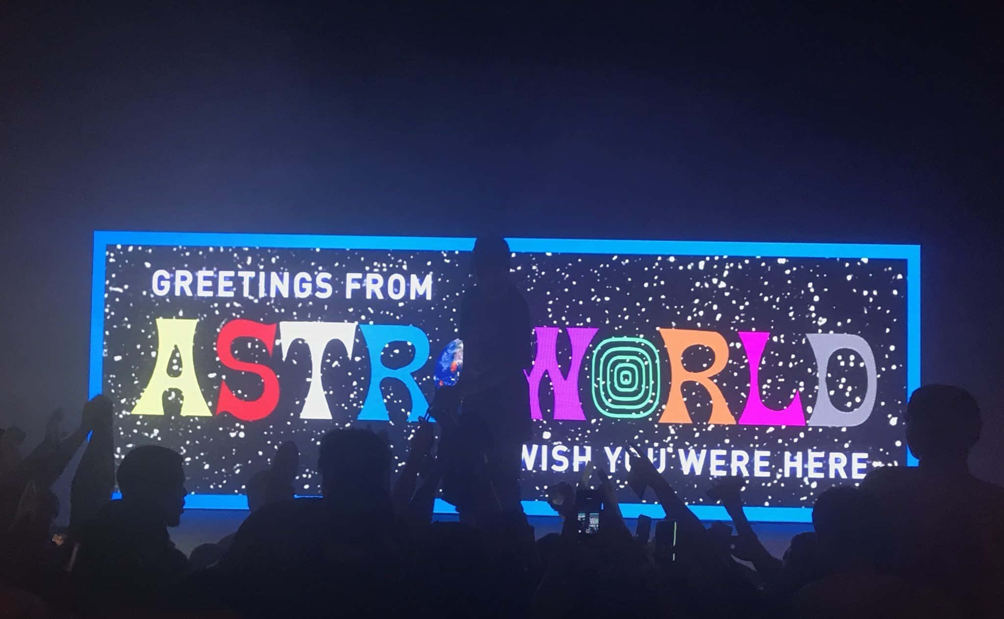 Astroworld 桌布 壁紙 — 剪影人群在夜間對著一個巨大的發光AstroWorld標誌歡呼，標誌上閃爍著星星。