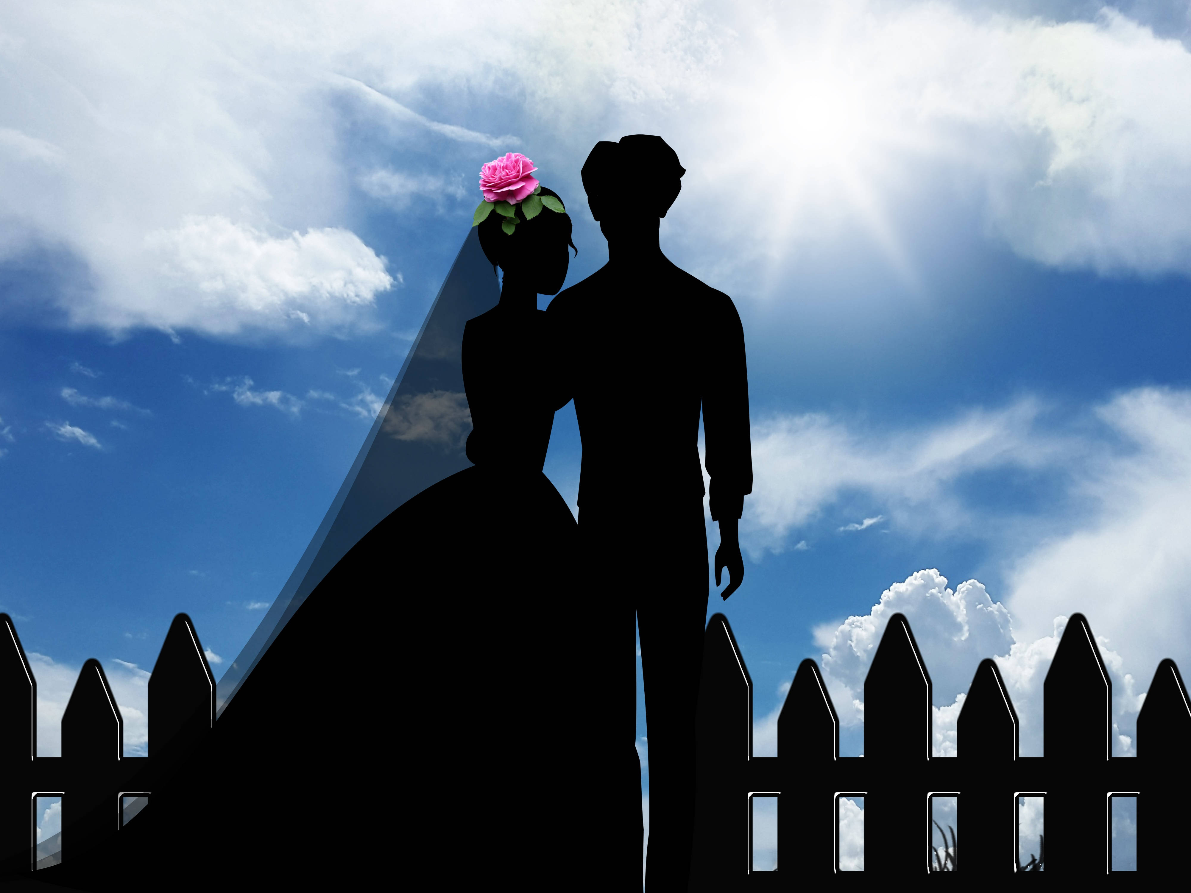 Groom 桌布 壁紙 — 剪影情侶在明亮的藍天、蓬鬆的雲朵和陽光照射下緊密地站在一起。