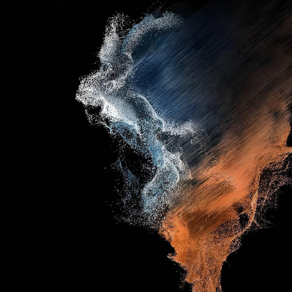 Themes 桌布 壁紙 — 動態抽象粒子以藍色和橙色旋轉，在純黑背景上營造出宇宙爆炸效果。