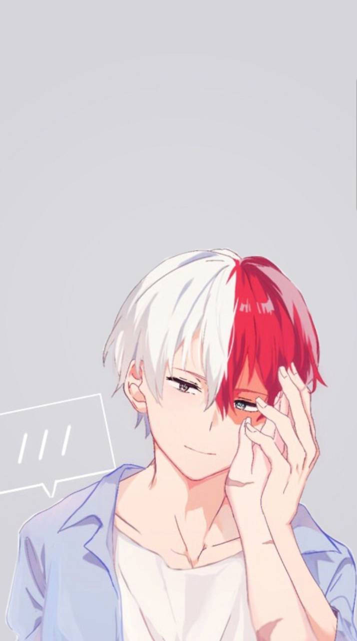 轟焦凍可愛 桌布 壁紙 — 動漫男孩，頭髮一半白色一半紅色，在純灰色背景上輕輕觸碰自己的眼睛。