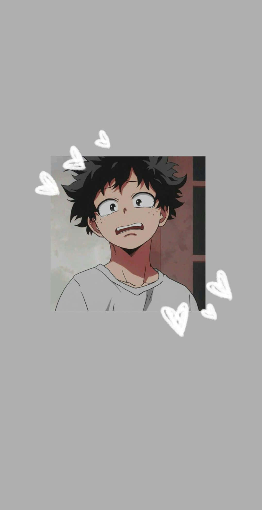 綠谷出久 桌布 壁紙 — 動漫男孩，黑色亂髮，大眼睛，被漂浮的白色心形包圍，背景灰色。