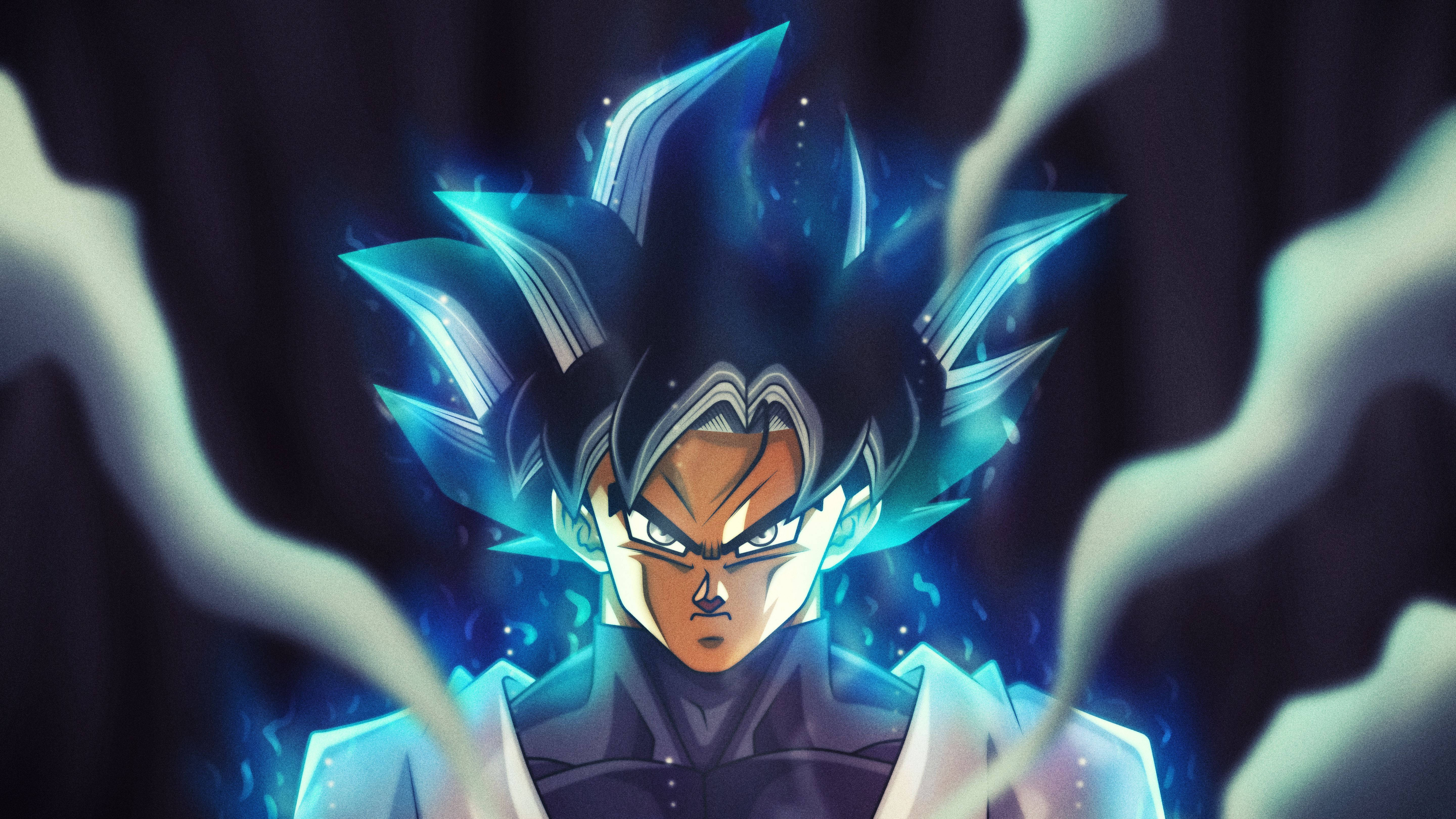 Goku Dragon Ball Super 桌布 壁紙 — 動漫角色，擁有發光的藍色尖刺頭髮和強烈的眼睛，被旋轉的能量包圍，背景為深色。