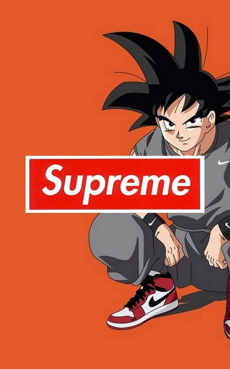orange supreme 桌布 壁紙 — 動漫角色悟空在橙色背景前蹲下，帶有Supreme標誌和Nike運動鞋。