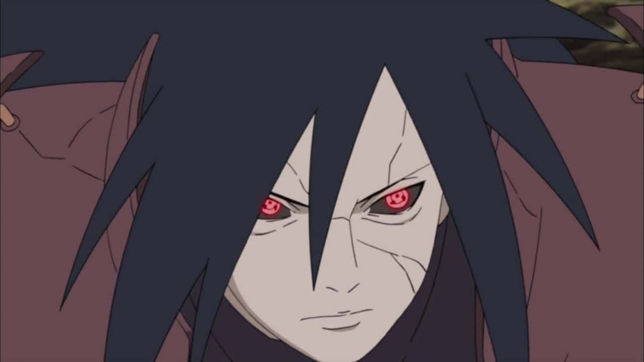 Madara Cool 桌布 壁紙 — 動漫角色特寫，深色頭髮，紅色發光眼睛，展現強烈專注。