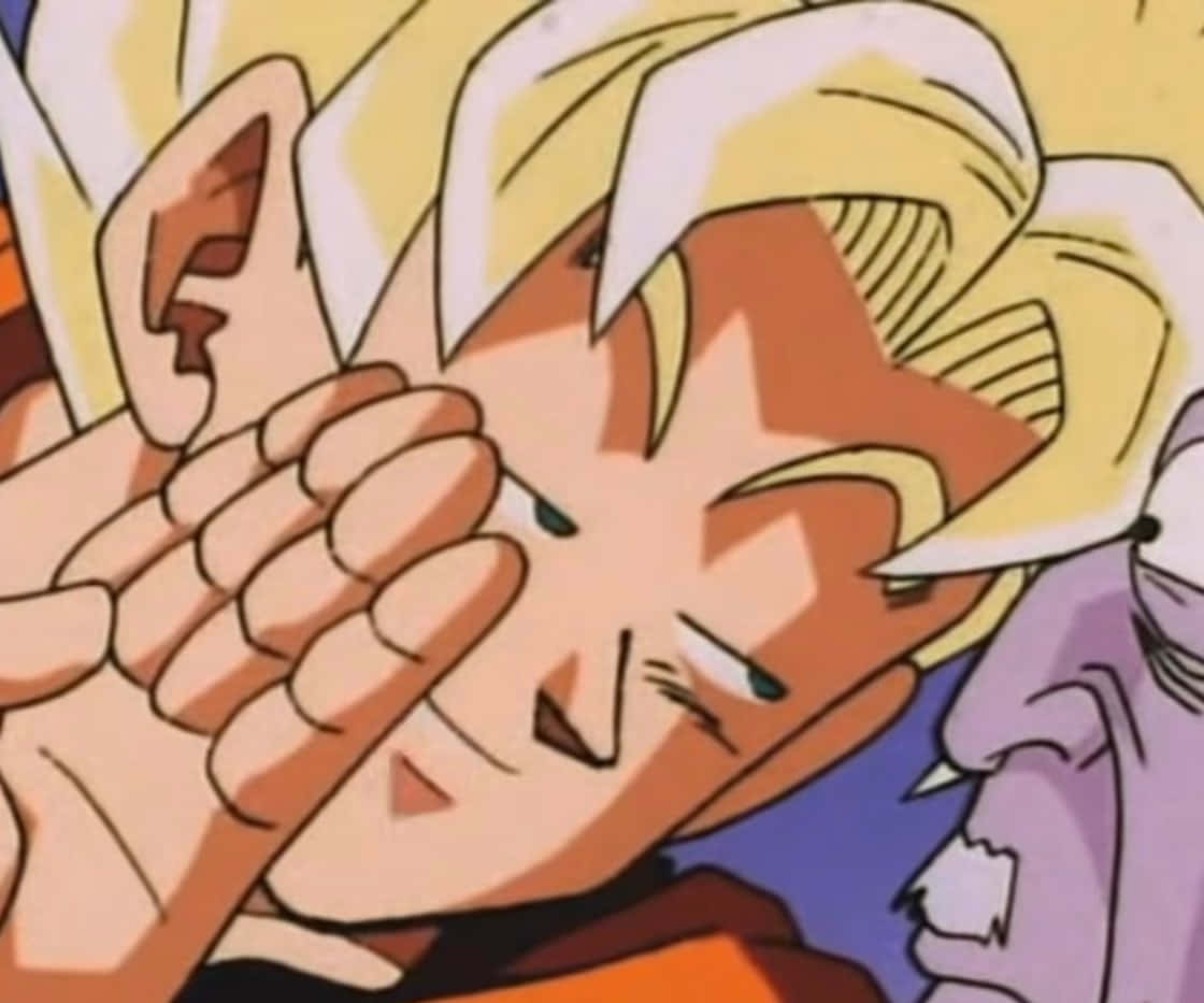 Funny Goku 桌布 壁紙 — 動漫角色留著刺狀金髮，在特寫鏡頭中用一隻手遮住臉。