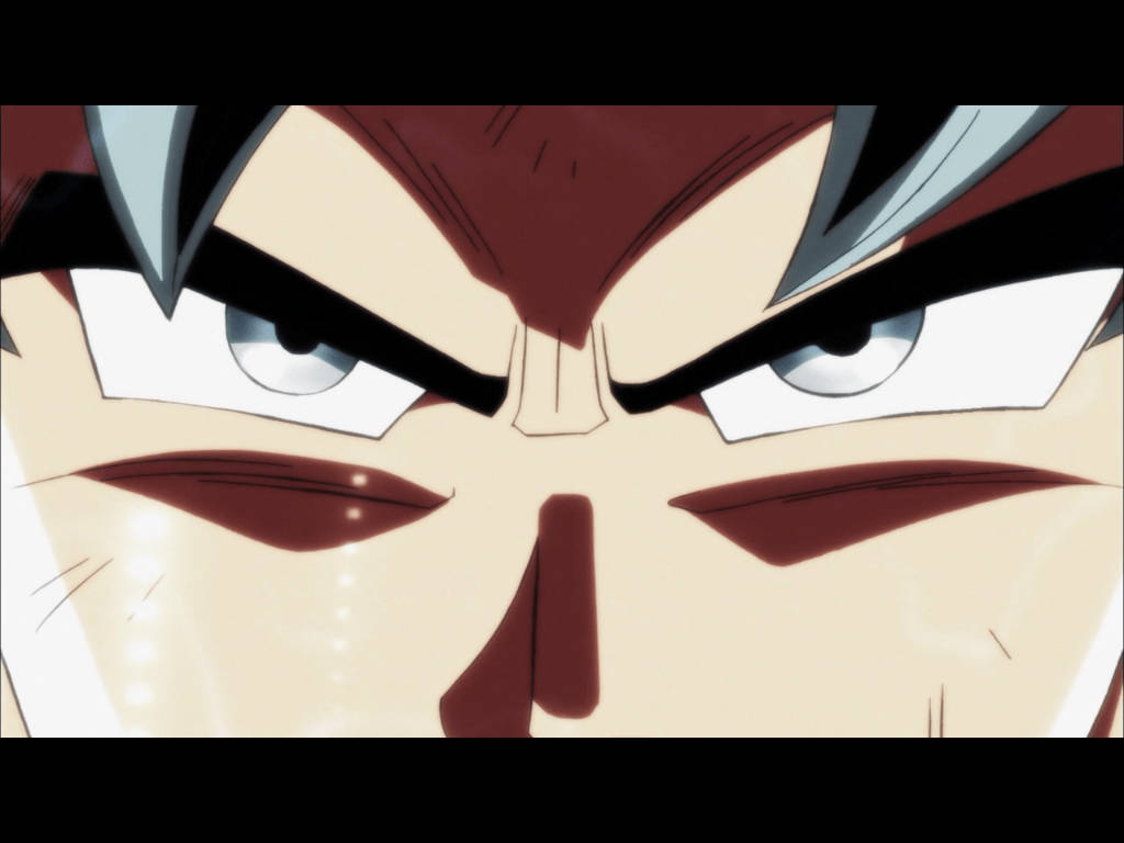 Ultra Instinct Goku 桌布 壁紙 — 動漫角色面部特寫，眼神銳利、眉頭緊鎖，展現出強烈的決心。