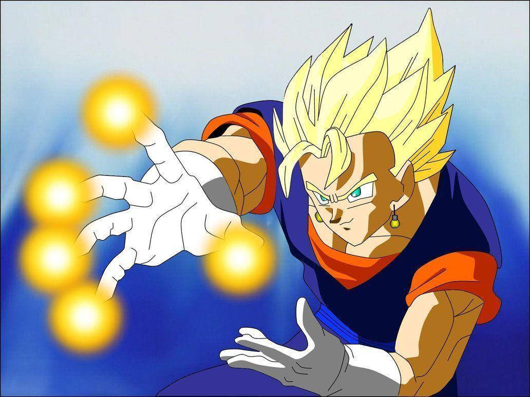 Vegito 桌布 壁紙 — 動畫角色貝吉塔以超級賽亞人型態，在藍色漸層背景前專注地引導發光的能量球。