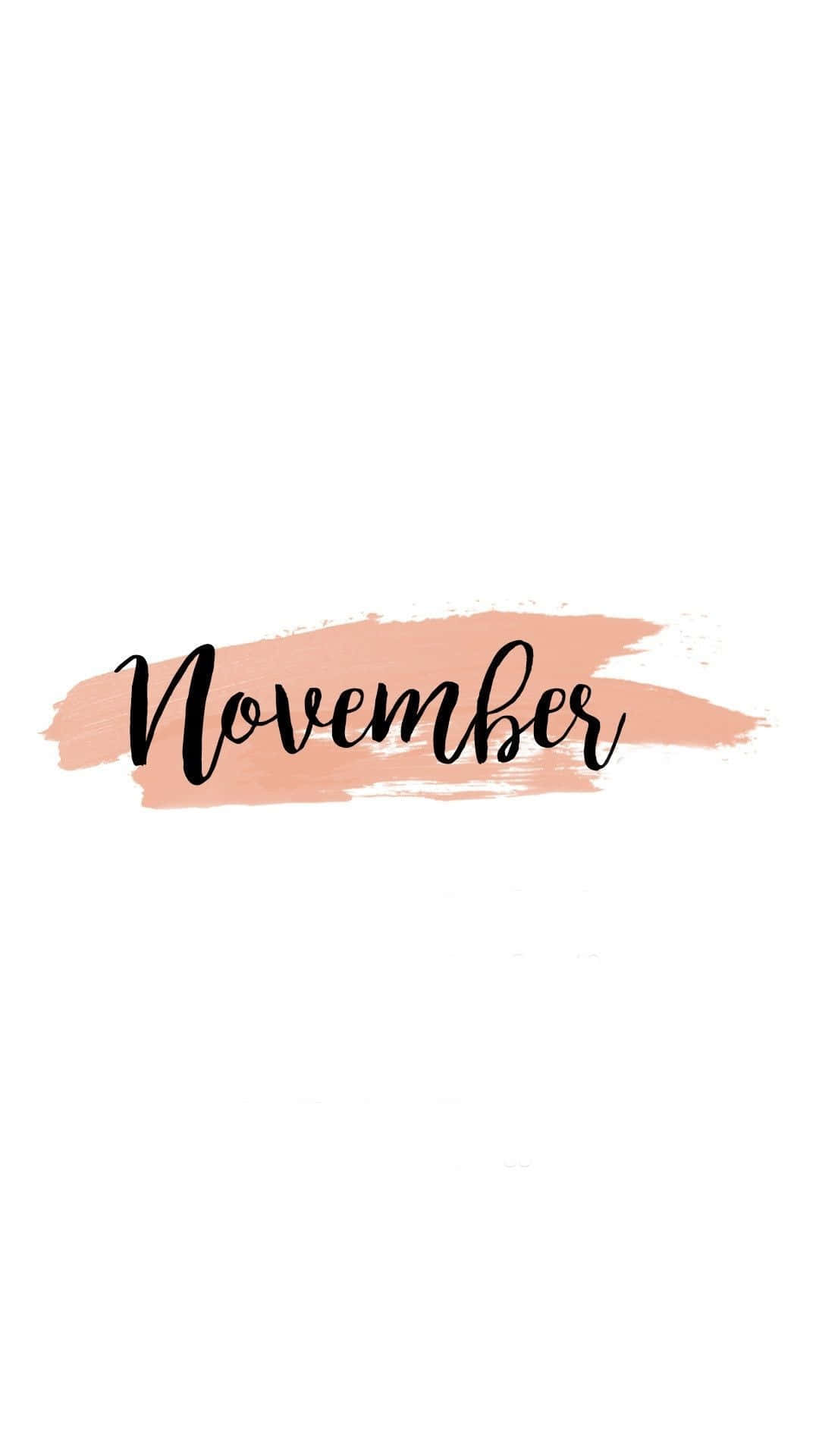 November 桌布 壁紙 — 十一月這個詞以優雅的黑色字體，在柔和的桃色水彩筆觸上，襯托在潔白的背景上。