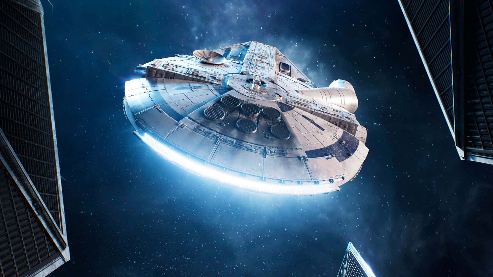 桌布 壁紙 — 千年鷹號在深邃太空中，由高聳的TIE戰機機翼框住的星域中滑行。