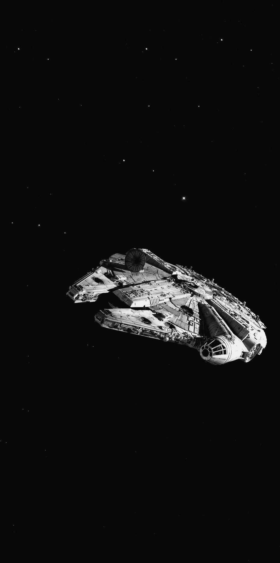 AMOLED 桌布 壁紙 — 千年鷹號太空船在星空中以鮮明的黑白滑翔。