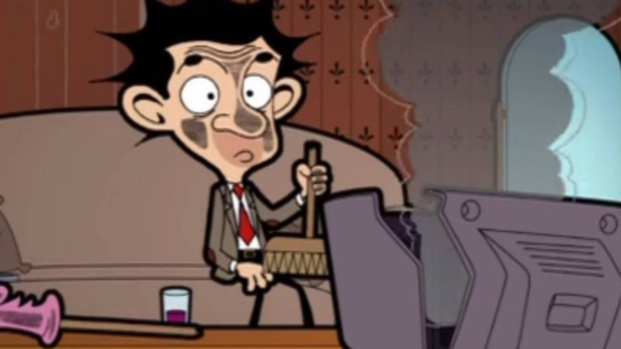 Funny Cartoon 桌布 壁紙 — 卡通人物 Mr. Bean 坐在書桌前，手持掃帚，表情驚訝，房間雜亂。