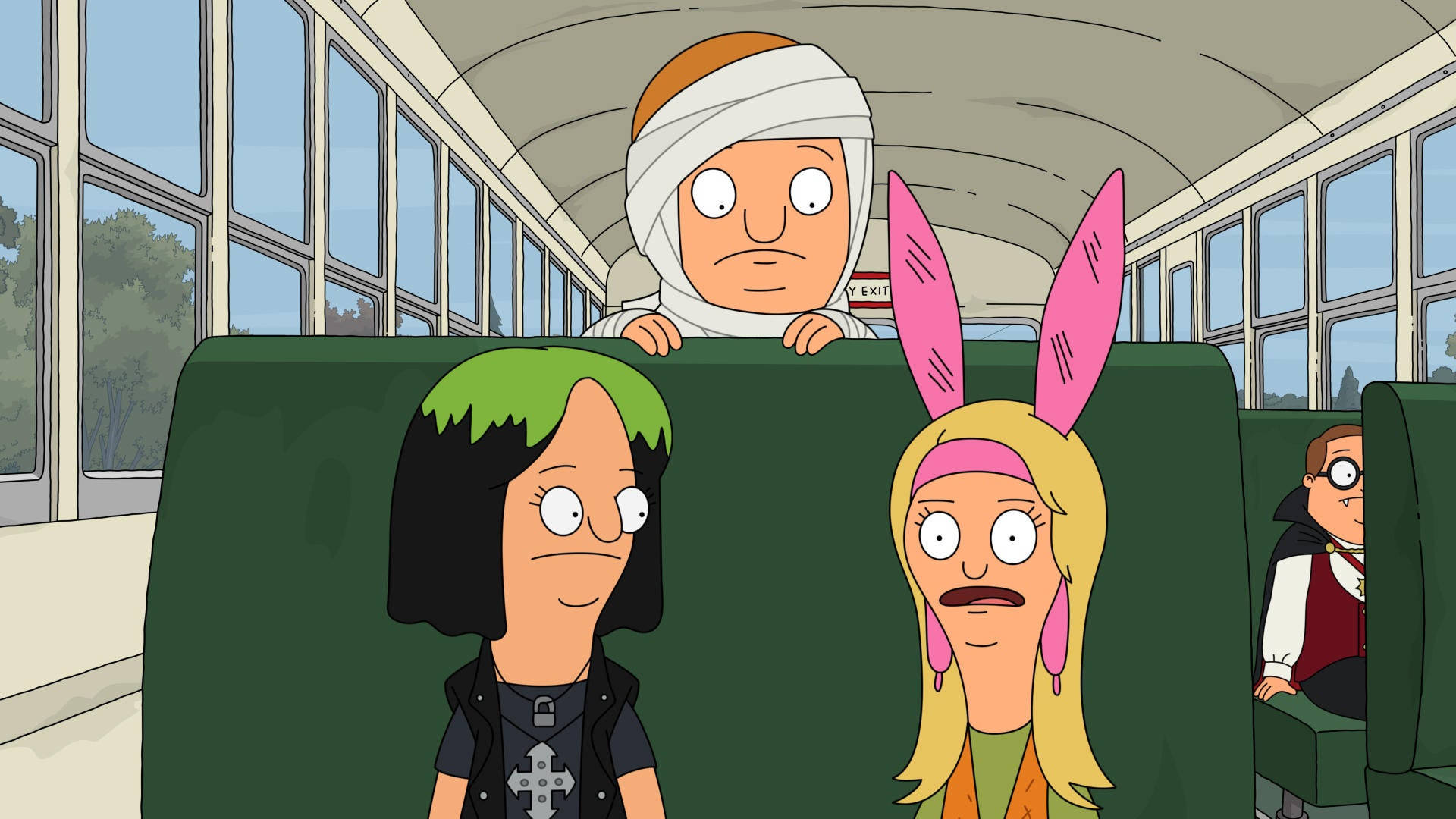 bobs burgers 桌布 壁紙 — 卡通人物穿著萬聖節服裝乘坐校車，表情驚訝。