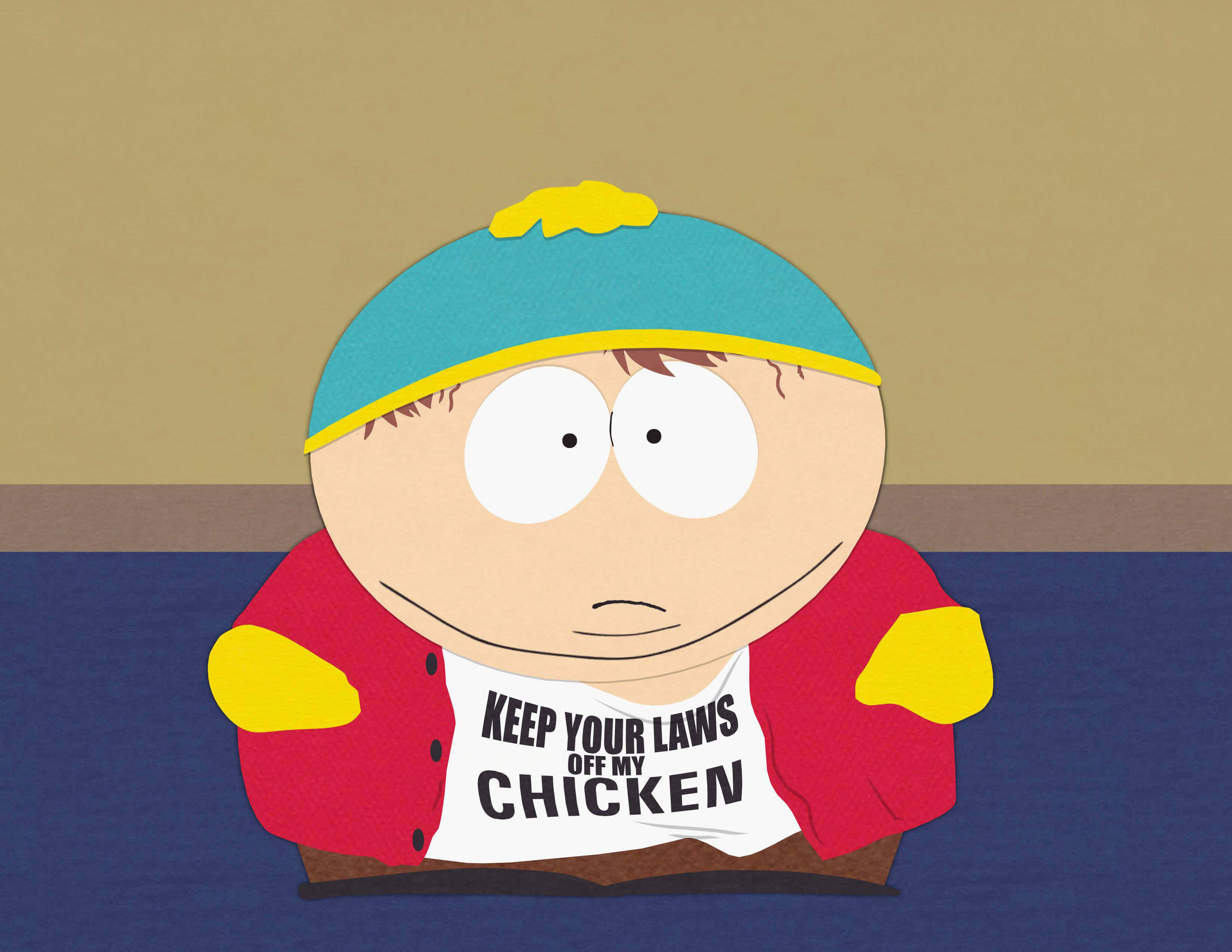 南方公園 桌布 壁紙 — 卡通男孩戴藍色帽子和紅色外套，穿著印有 keep your laws off my chicken 的T恤。