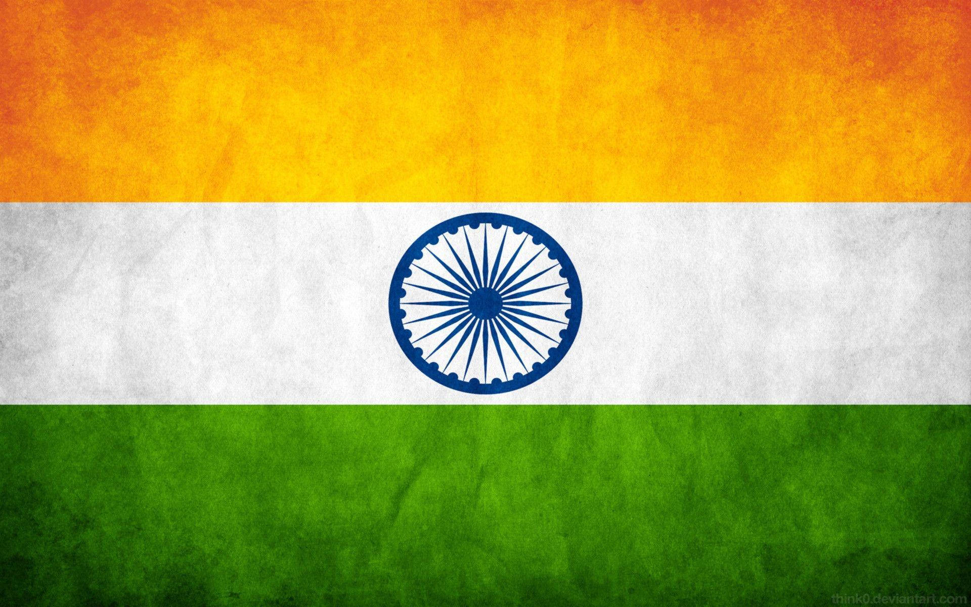 Indian 桌布 壁紙 — 印度國旗，帶有紋理的橙色、白色和綠色條紋，中央有一個藍色的阿育王法輪。