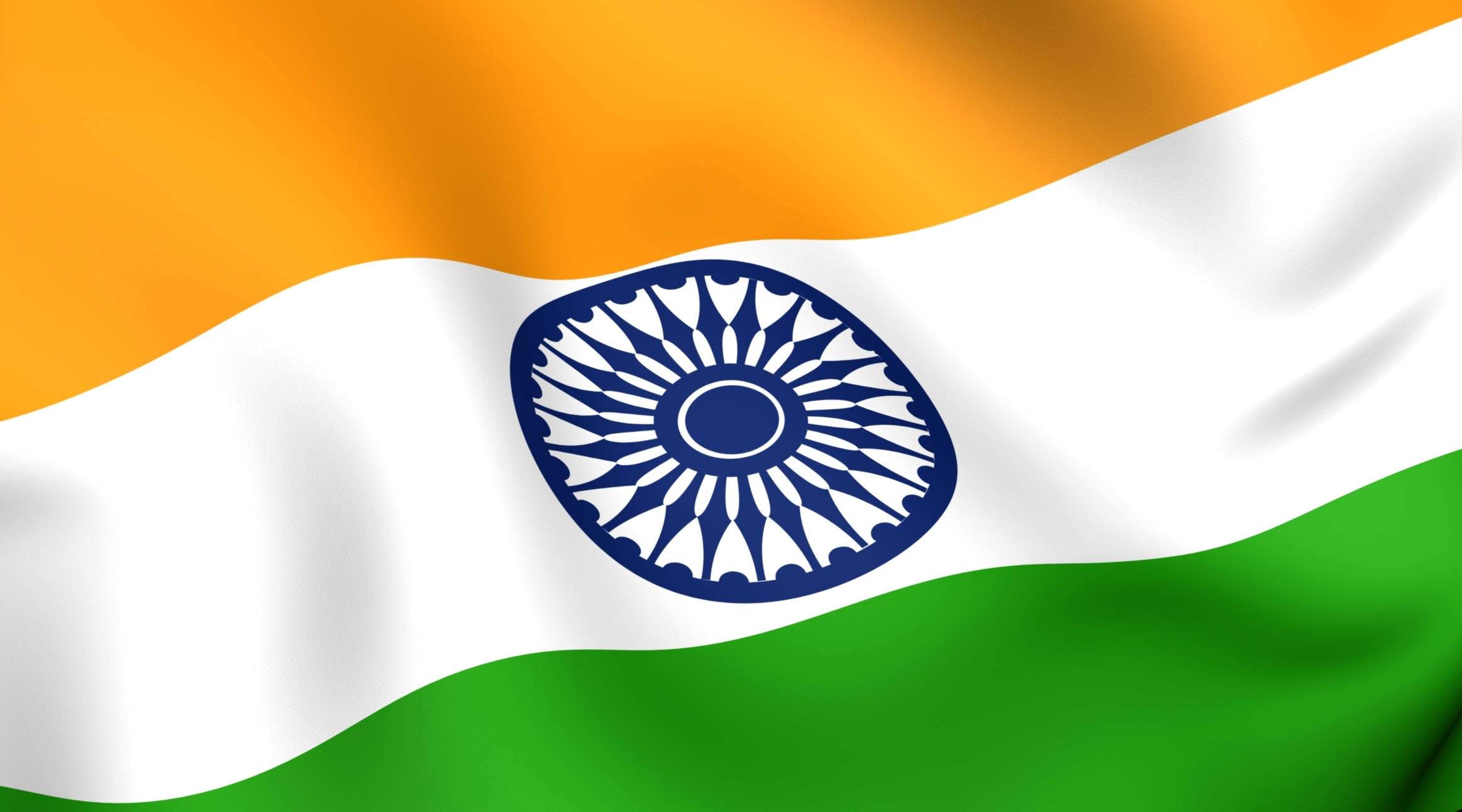 Indian 桌布 壁紙 — 印度國旗動態飄揚，帶有藏紅花、白色和綠色條紋，以及白色帶子中央的海軍藍色阿育王法輪。