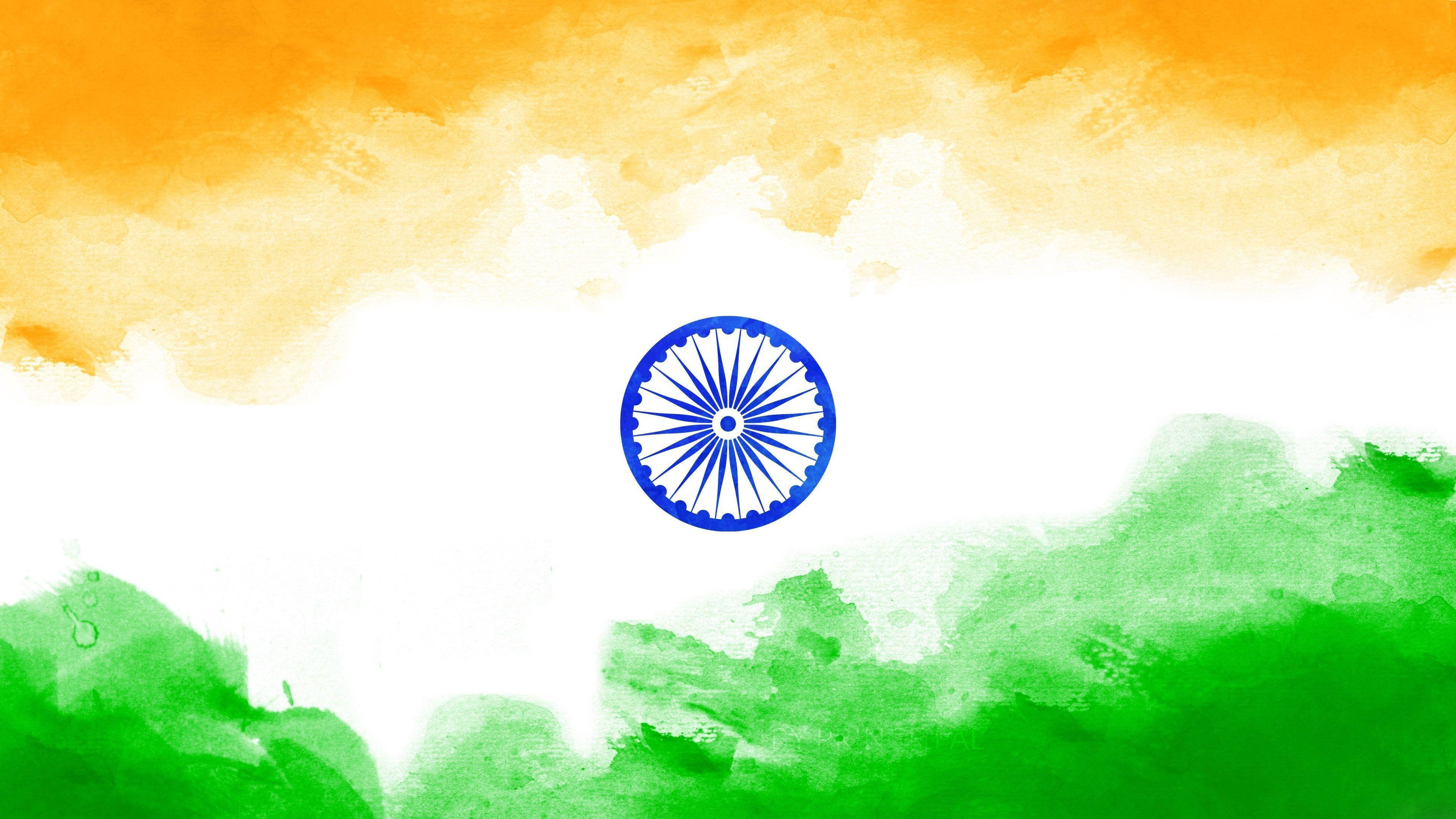 Indian 桌布 壁紙 — 印度國旗的水彩演繹，帶有藏紅花、綠色和白色條紋，以及藍色阿育王法輪置中。