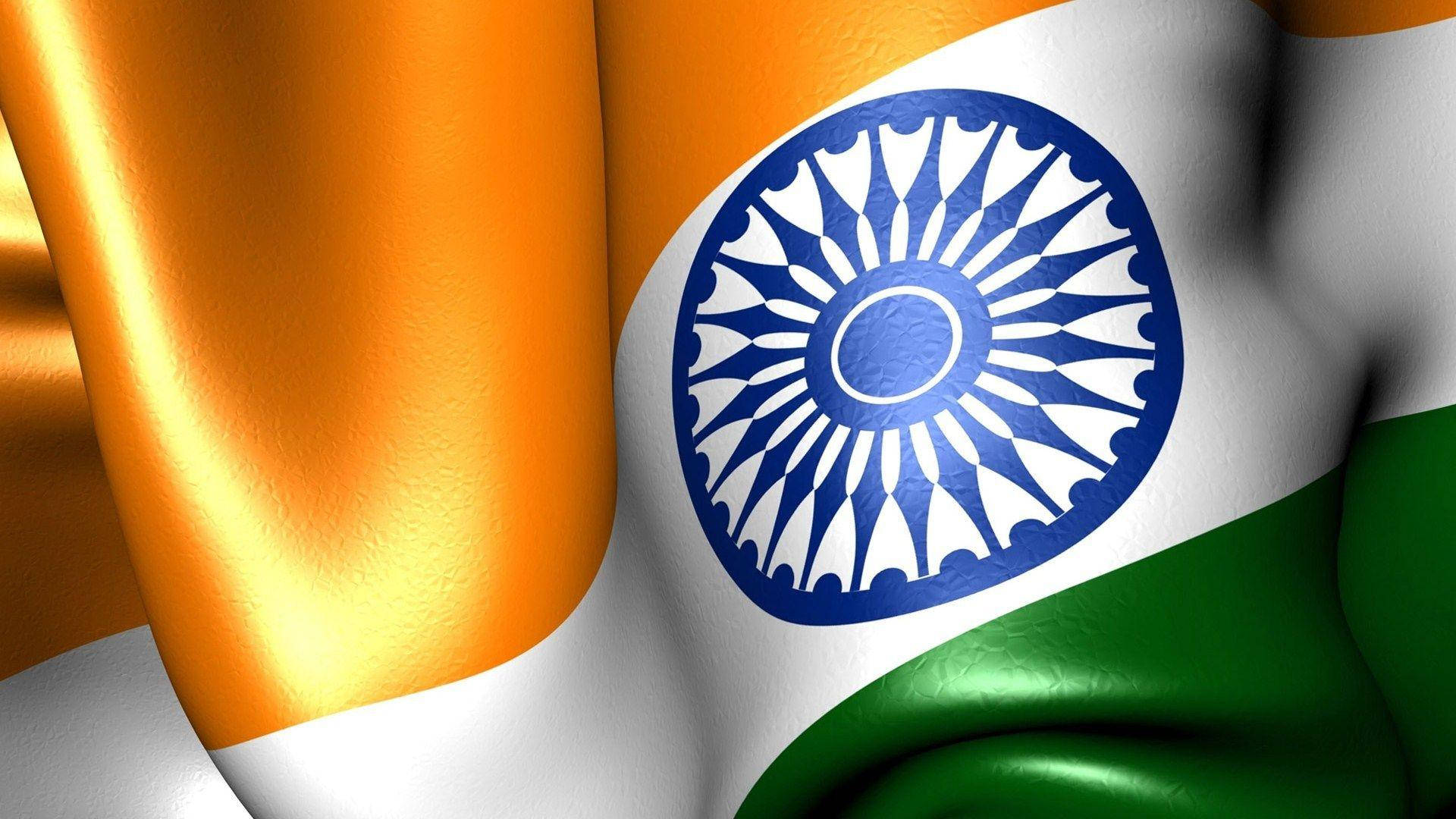 India 桌布 壁紙 — 印度國旗的特寫，飄揚著鮮豔的藏紅花、白色和綠色條紋，白色帶子中央有一個藍色的阿育王法輪。
