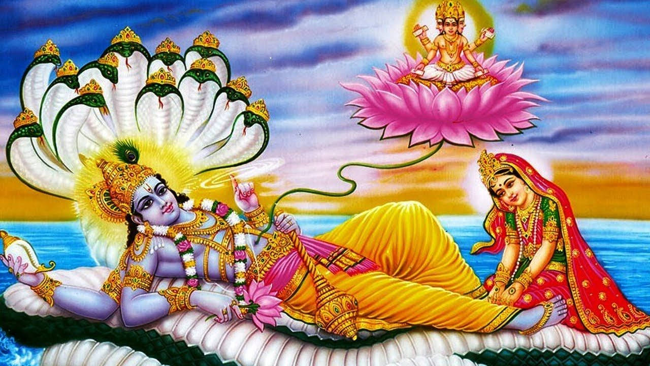 Lakshmi 桌布 壁紙 — 印度教神祇毗濕奴躺在一條巨蛇上，伴侶吉祥天女在他身邊，女神辯才天女在上方的蓮花上。
