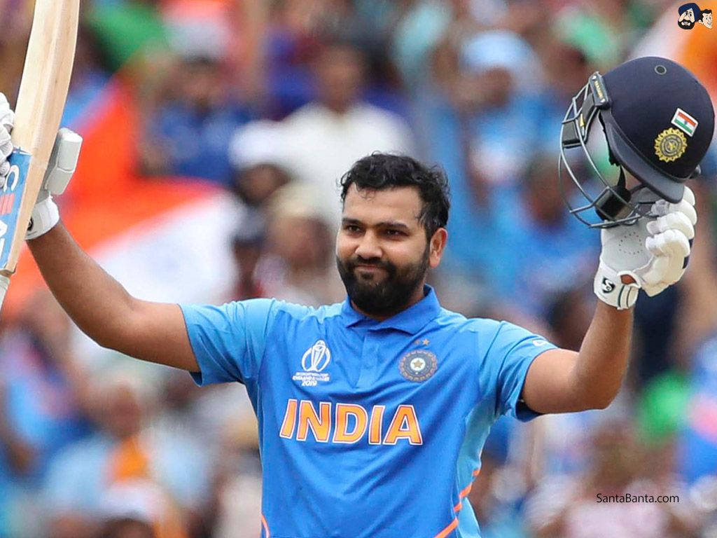 Rohit Sharma 桌布 壁紙 — 印度板球運動員在體育場人群中高舉球棒和頭盔慶祝勝利。