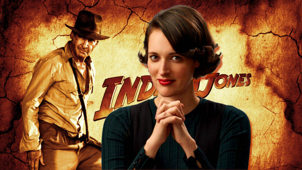 Indiana Jones 桌布 壁紙 — 印第安納瓊斯與一位身穿復古服裝的女性在龜裂的大地背景前擺姿勢，並配上粗體電影標題。