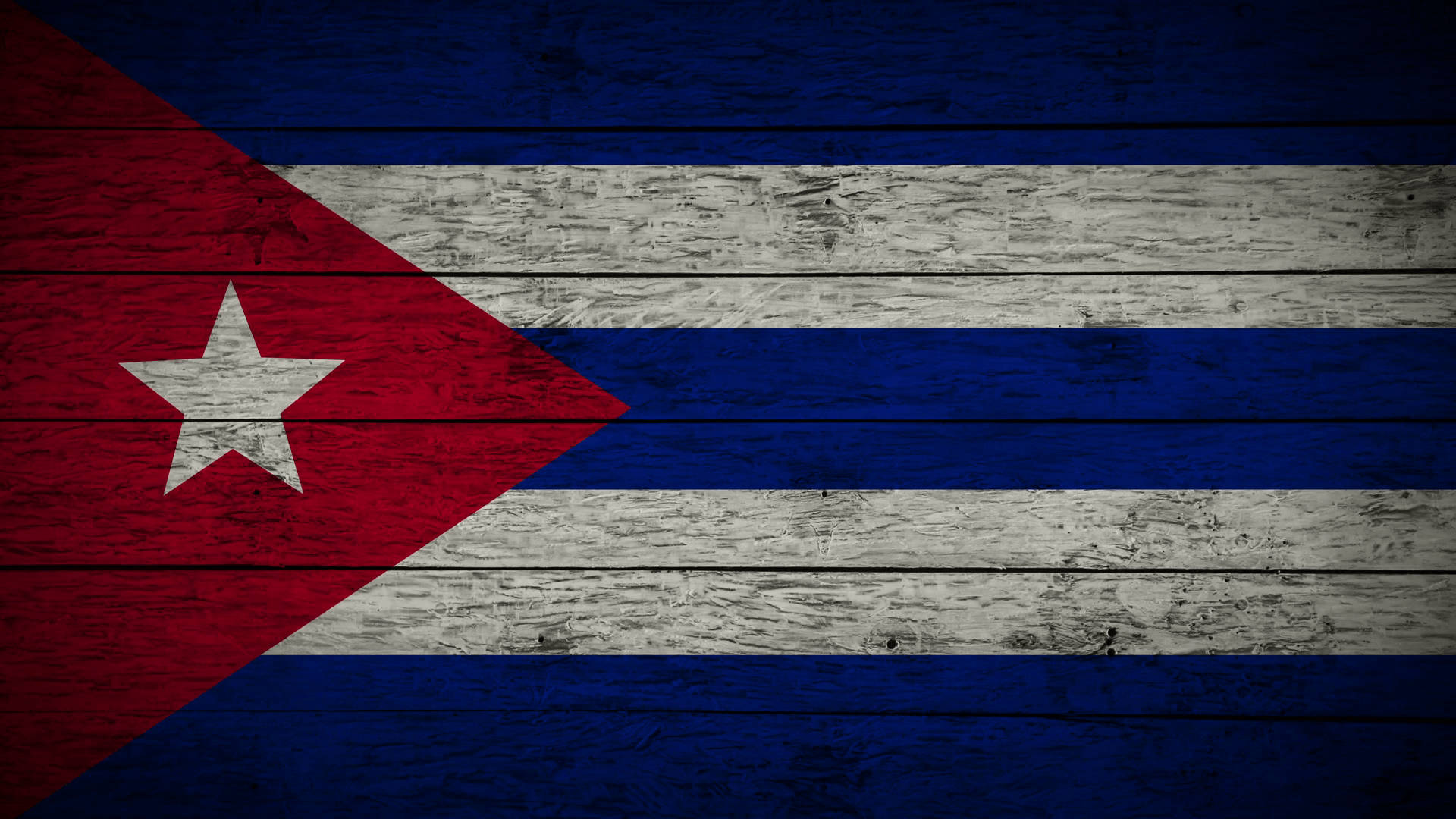Cuban 桌布 壁紙 — 古巴國旗繪於風化木板上，木紋清晰可見，油漆剝落質感明顯。