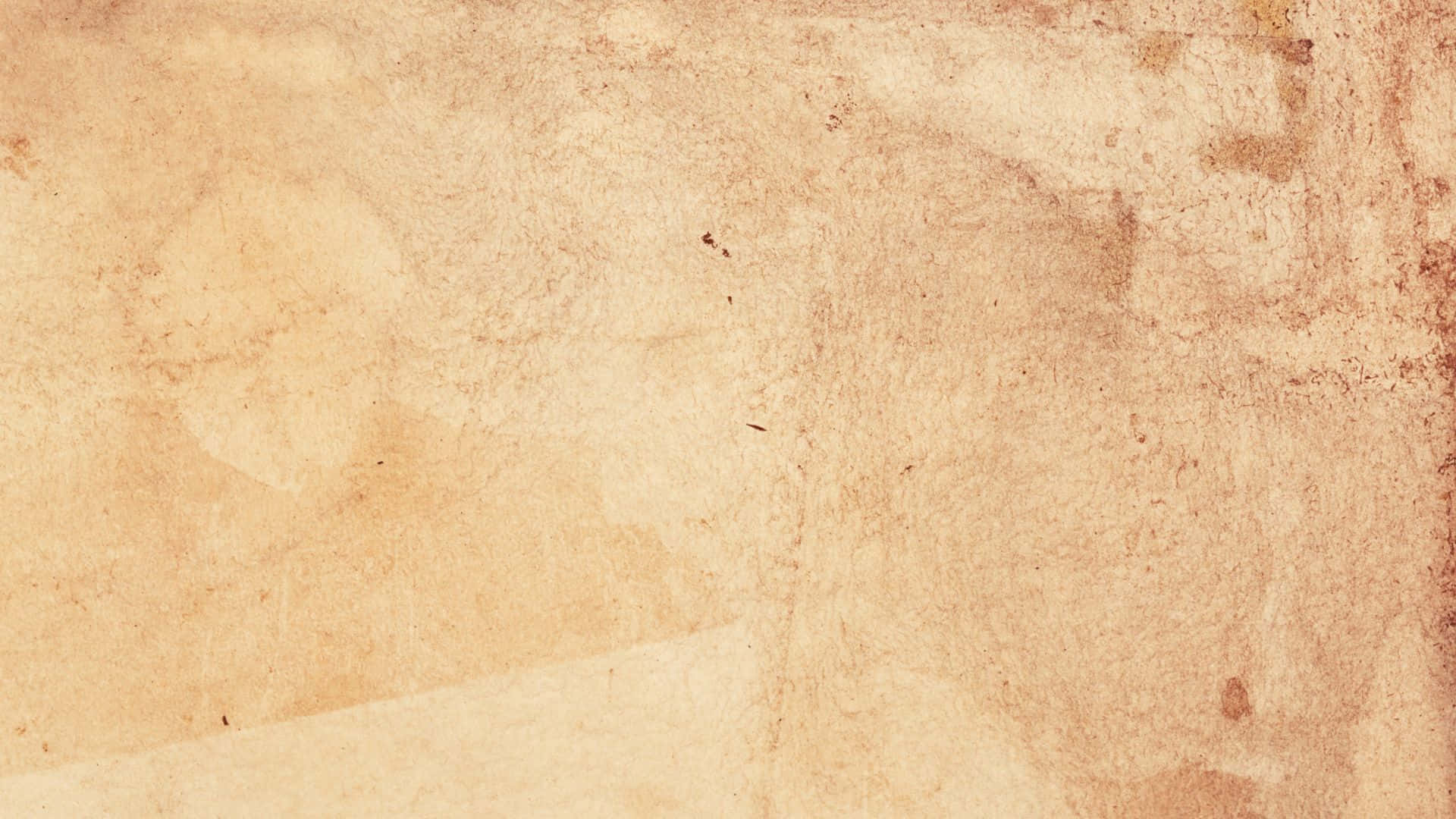 Old Paper Texture 桌布 壁紙 — 古老羊皮紙的特寫，帶有細微污漬和紋理磨損，展現復古特色。