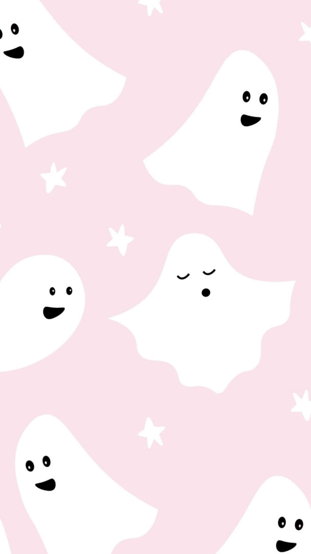 Pastel Halloween 桌布 壁紙 — 可愛的白色卡通鬼魂帶著簡單的笑臉，在點綴著白色星星的柔和粉紅色背景上輕輕飄浮。